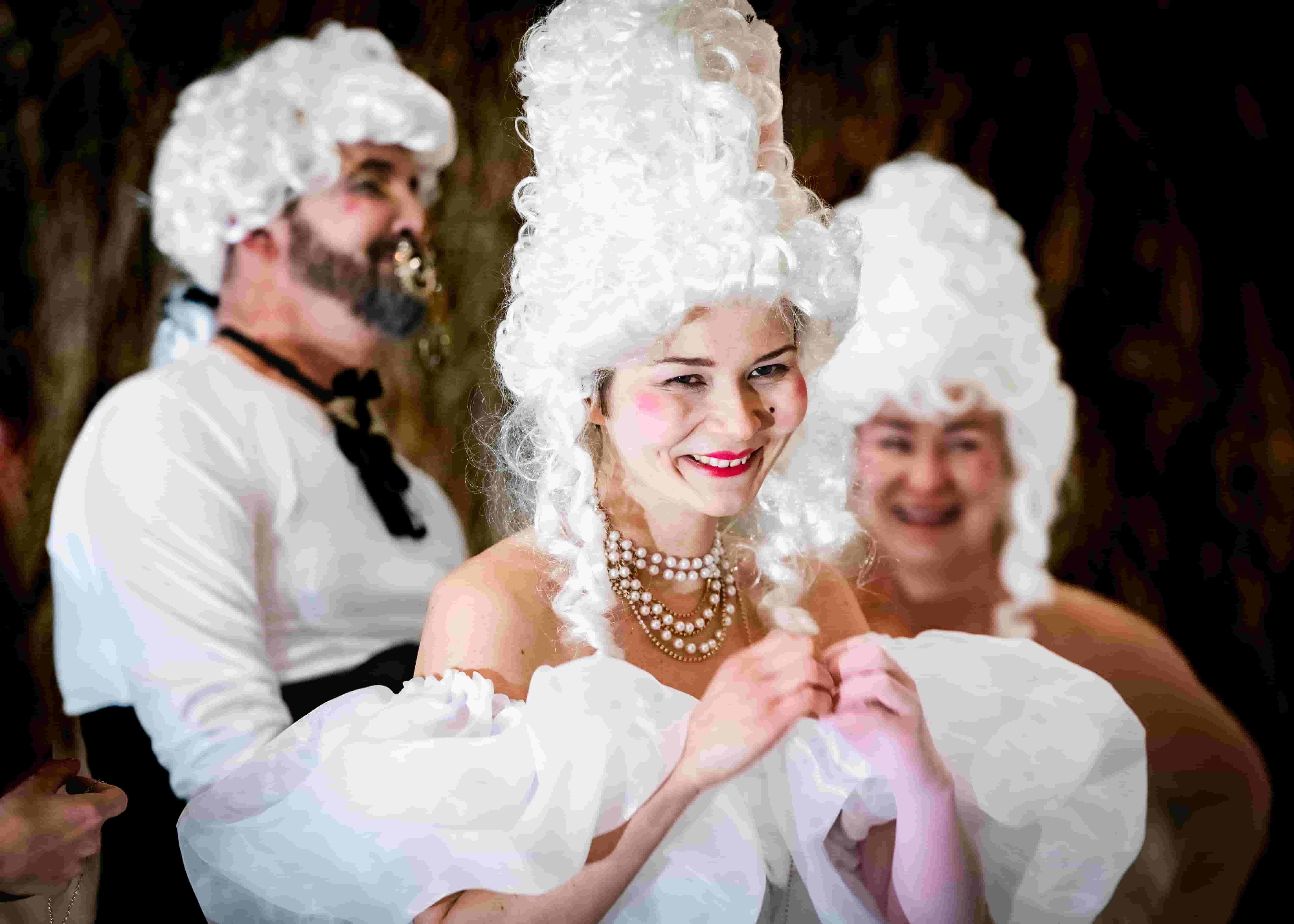 Woman in a white wig and pearls smiling, surrounded by others in Rococo-style costumes and makeup. -w Legnicy, we Wrocławiu, w Opolu, w Brzegu, w Oławie, w Lubinie - optimized version for fast loading
