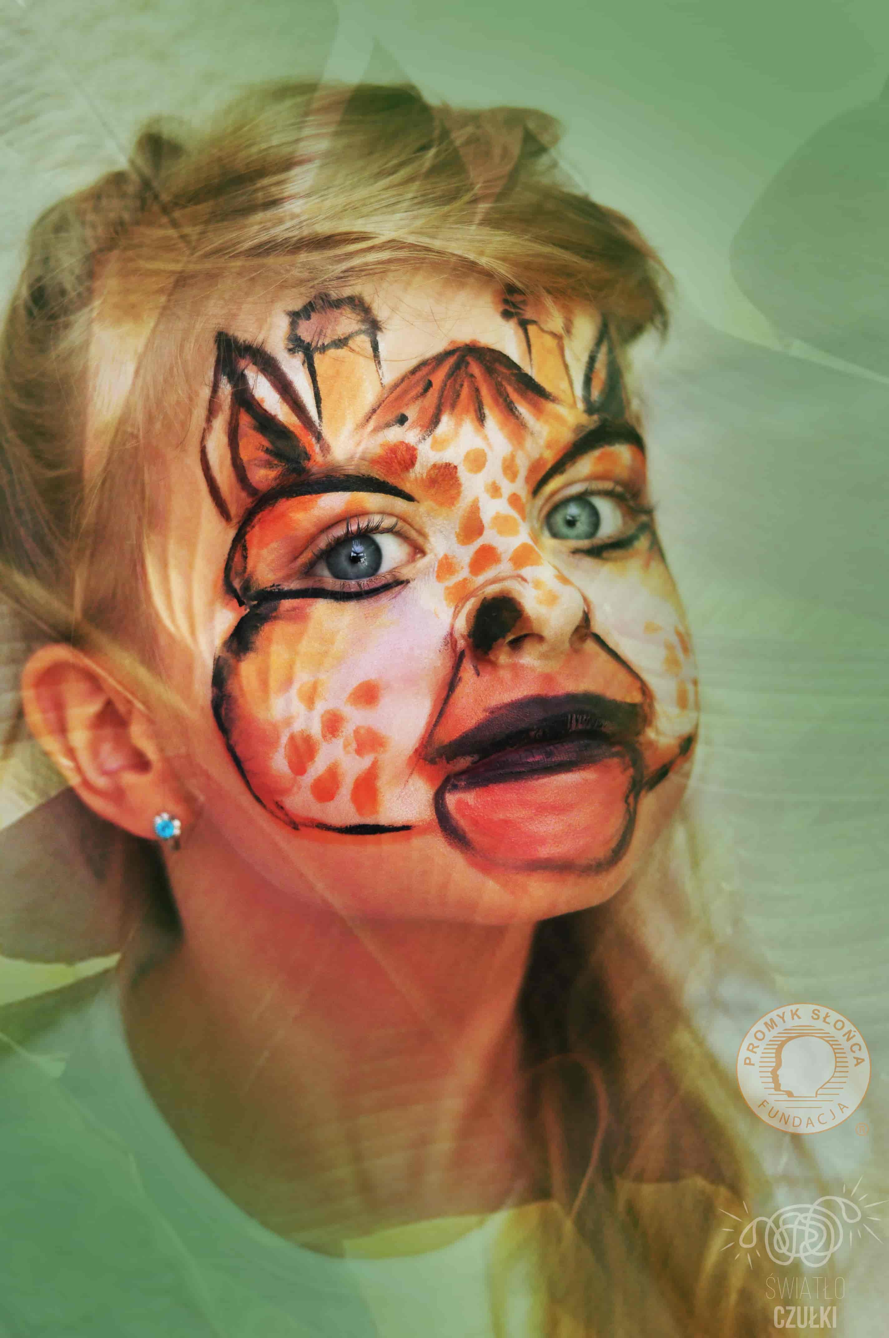 Child with face painted in giraffe patterns, smiling with bright eyes. -Legnica, Wrocław, Opole, Brzeg, Oława, Lubin - optimized version for fast loading