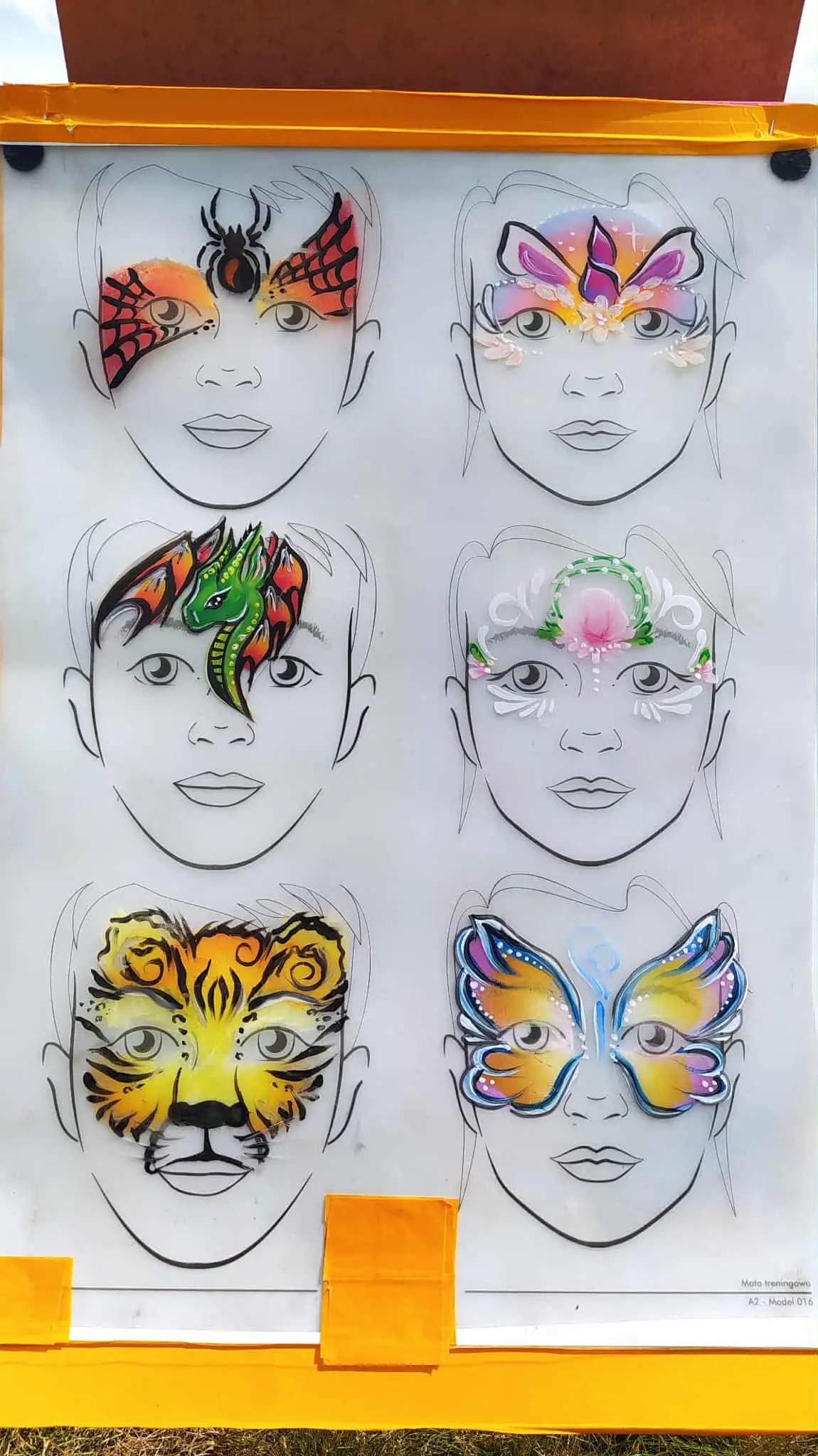 Board with six face painting designs: spider, unicorn, dragon, floral design, tiger, and butterfly. -w Lubinie, w Brzegu, w Oławie, we Wrocławiu, w Opolu, w Legnicy - optimized version for fast loading