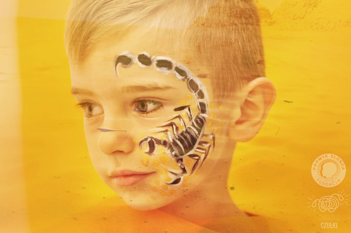 A scorpion painted on the face